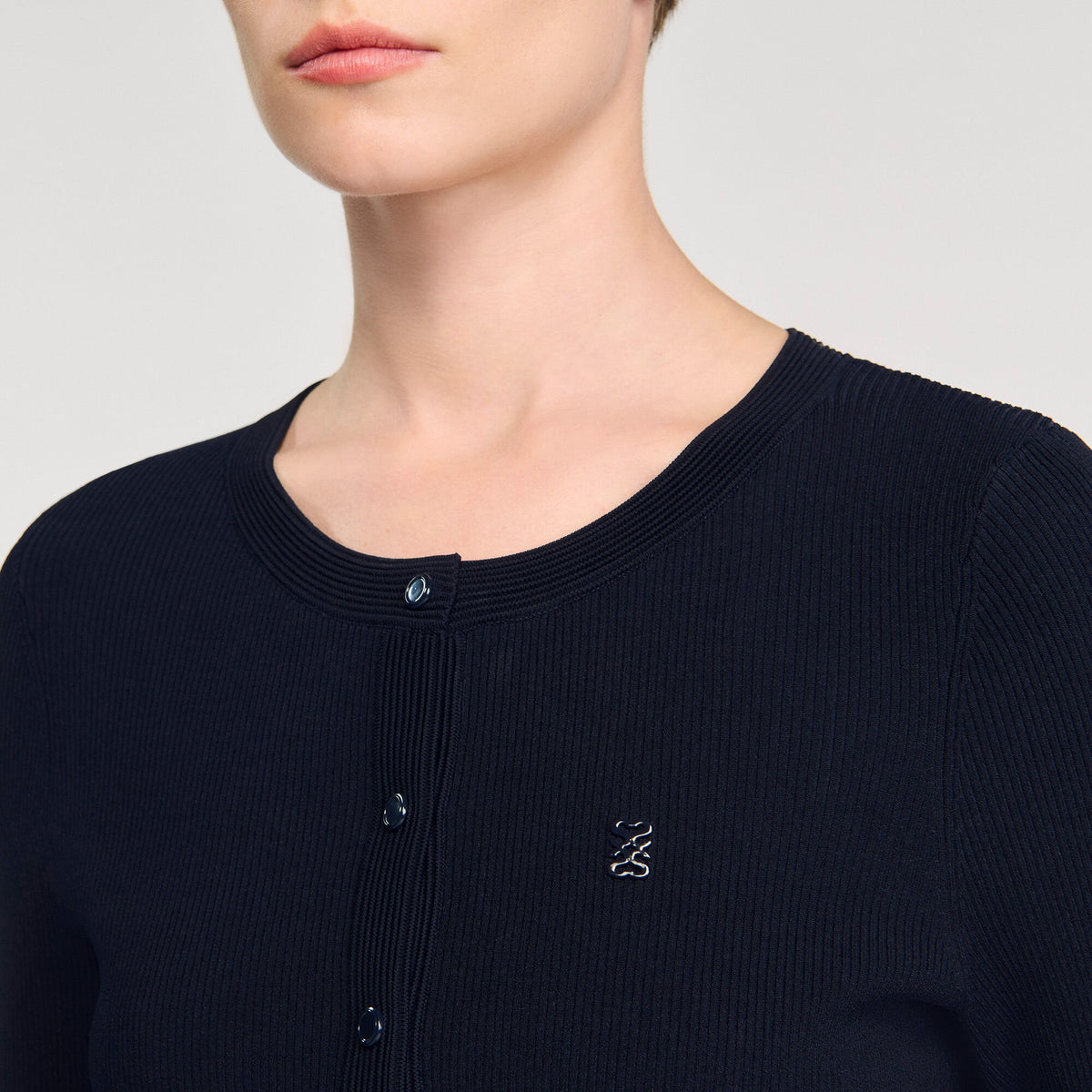 Sandro Polo shirt with decorative buttons