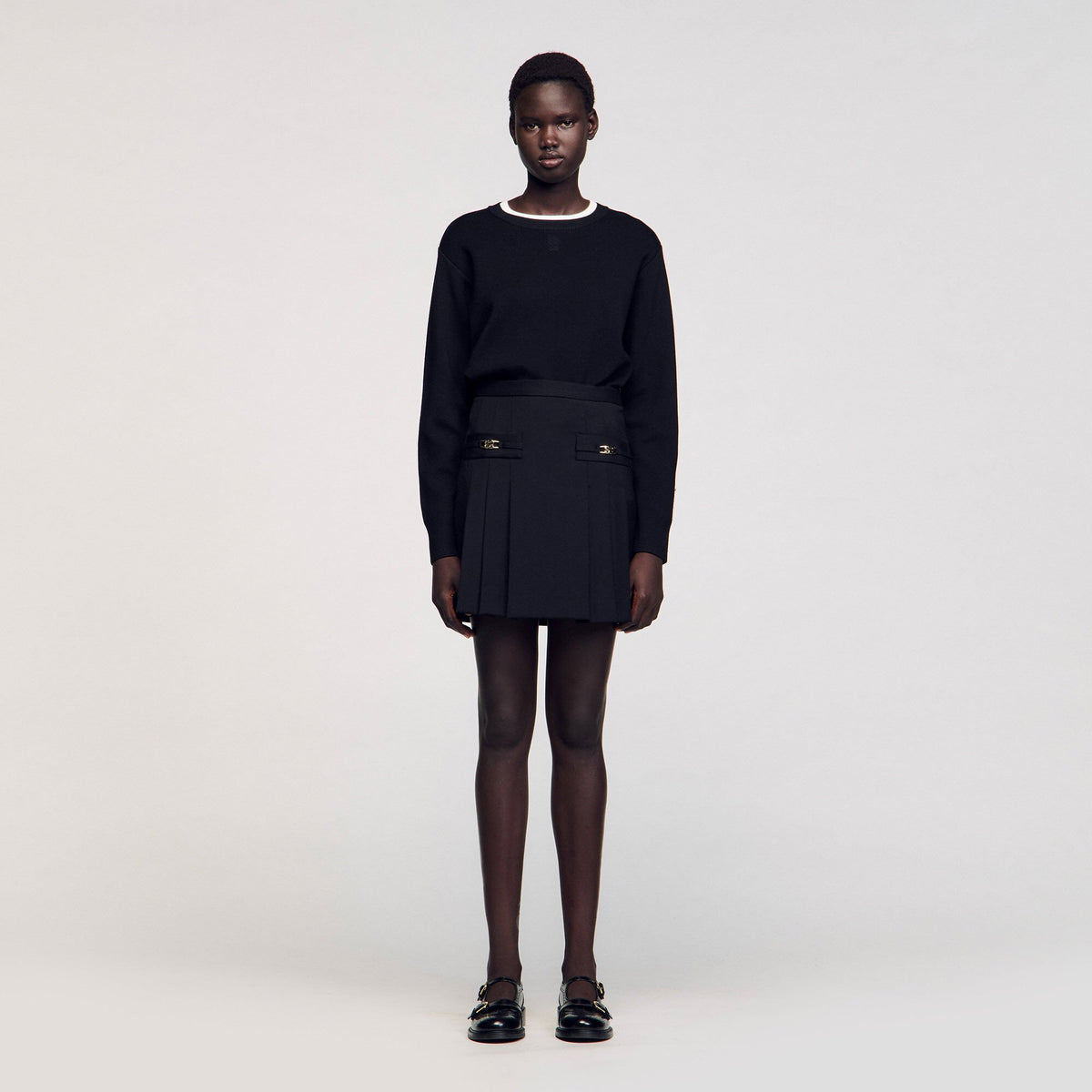 Sandro Mini skirt with stitched pleats