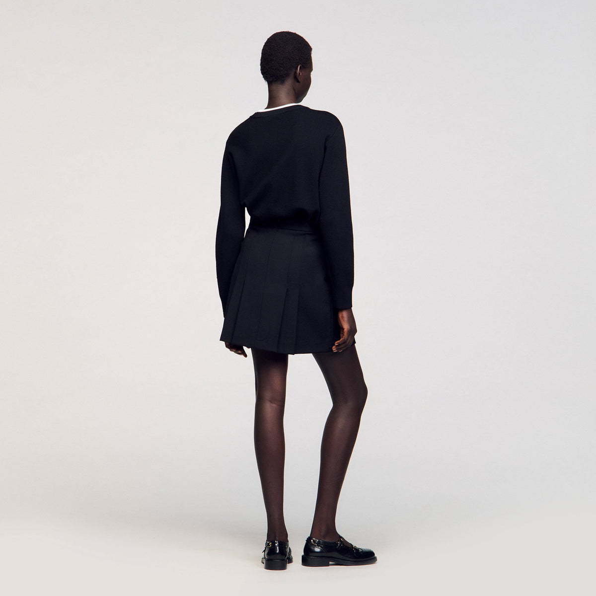 Sandro Mini skirt with stitched pleats