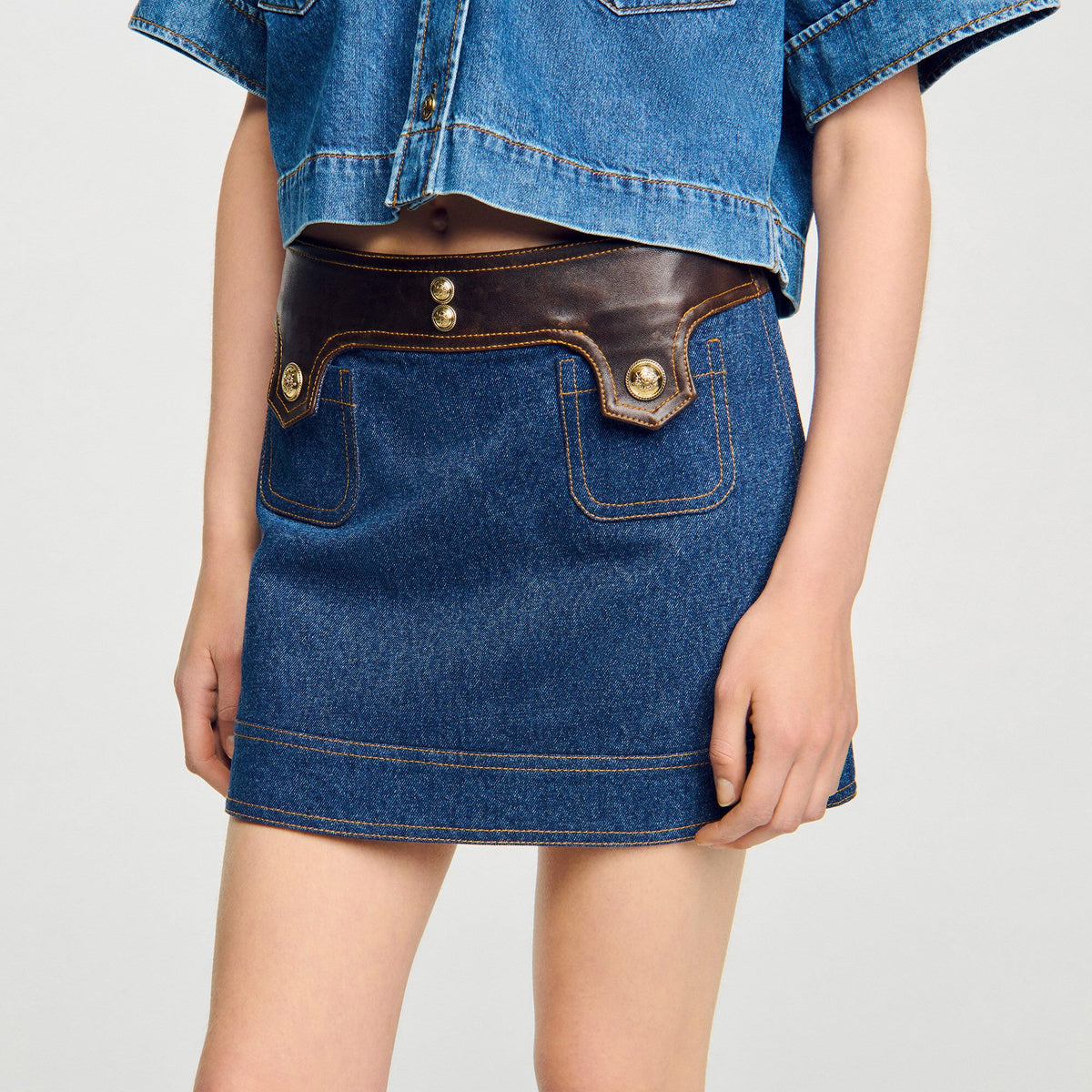 Sandro Mini denim and leather skirt