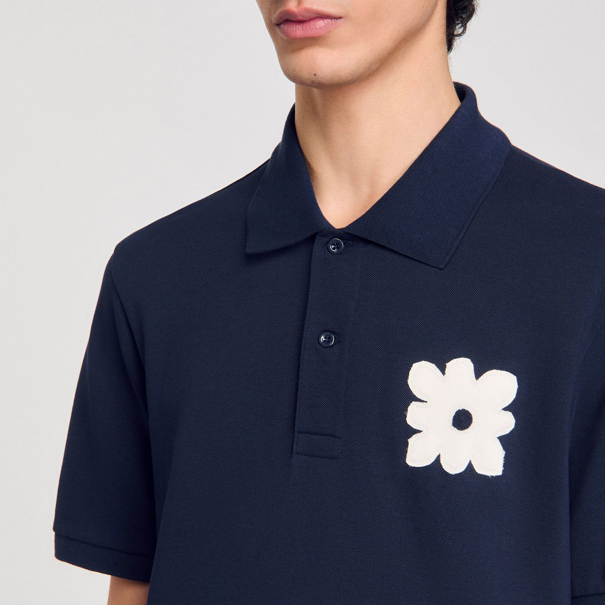 Sandro Polo shirt with flower patch
