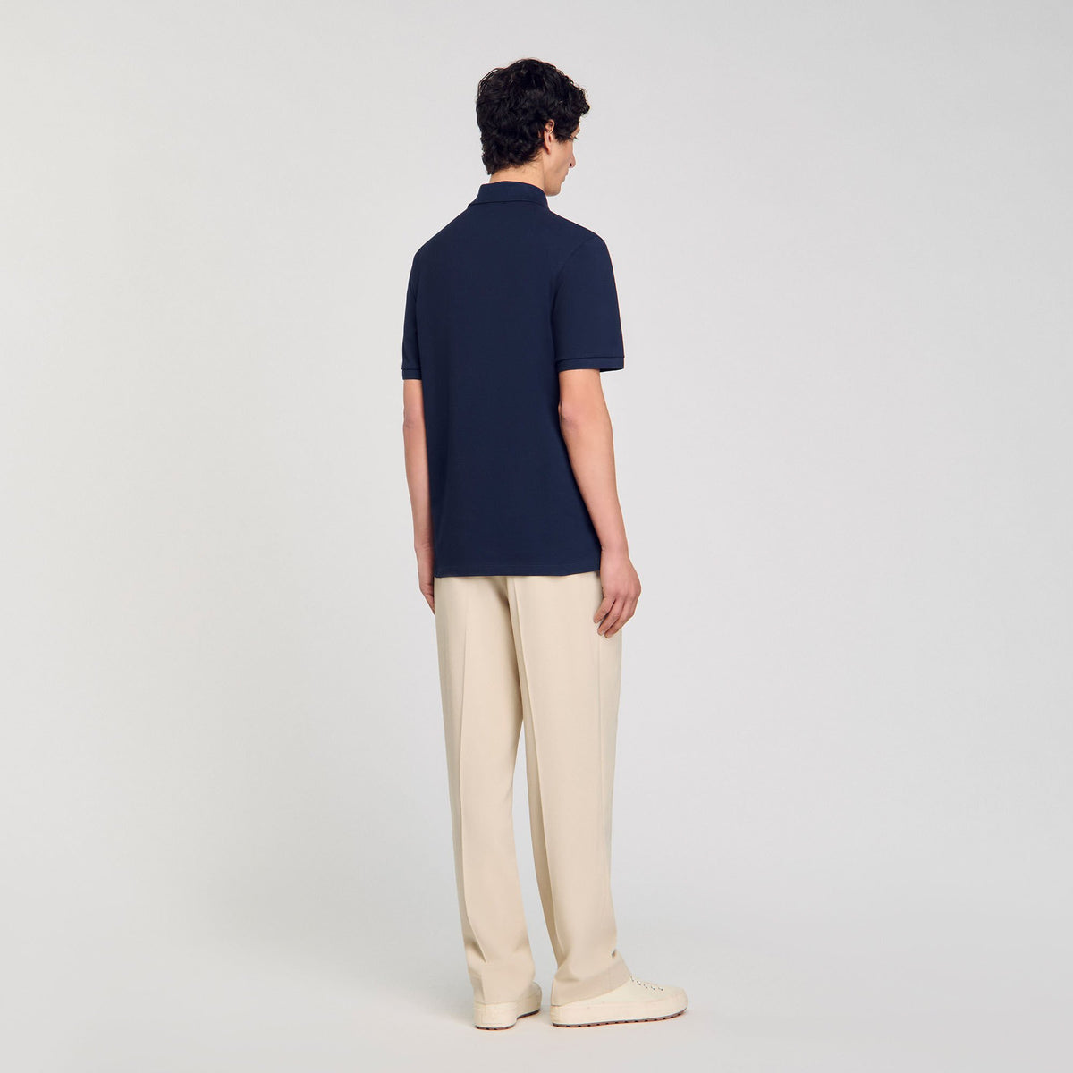 Sandro Polo shirt with flower patch