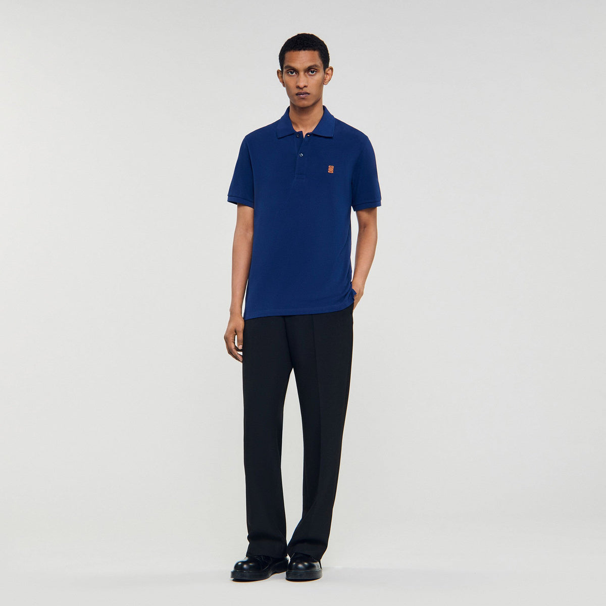 Sandro Polo shirt with leather logo