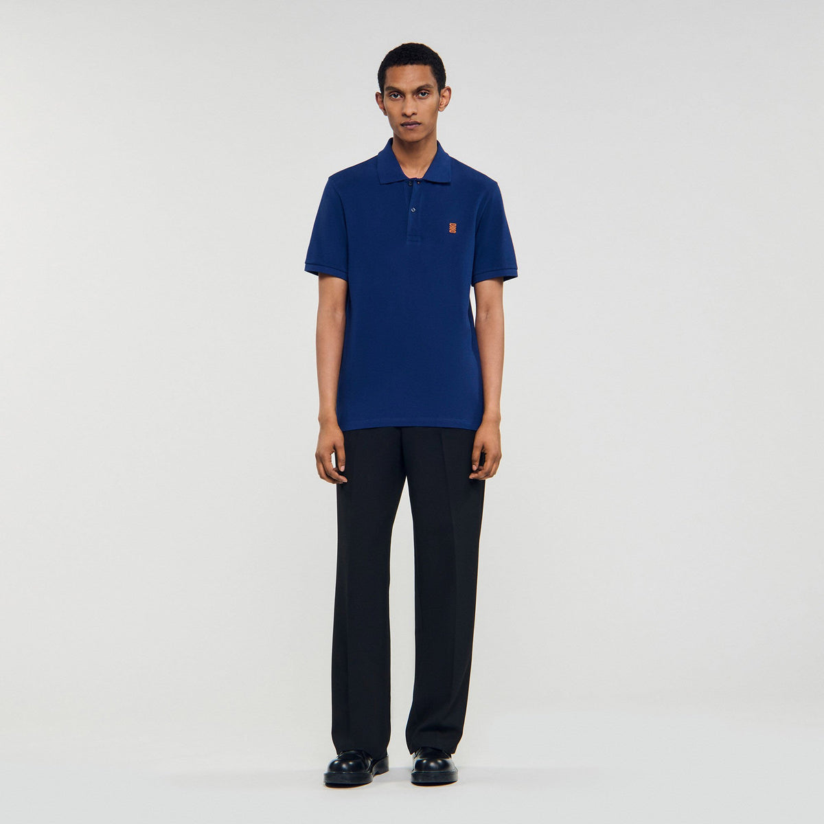 Sandro Polo shirt with leather logo