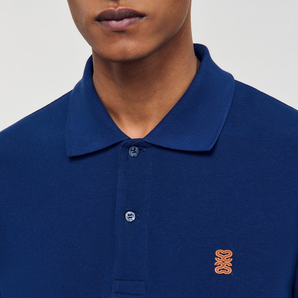 Sandro Polo shirt with leather logo