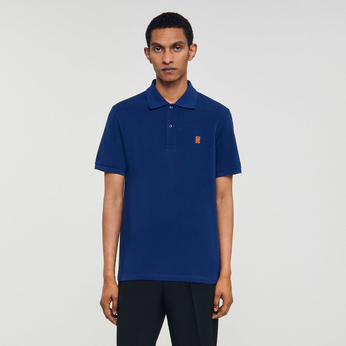 Sandro Polo shirt with leather logo